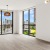 floor-to-ceiling windows brighten spacious living room