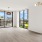 floor-to-ceiling windows brighten spacious living room